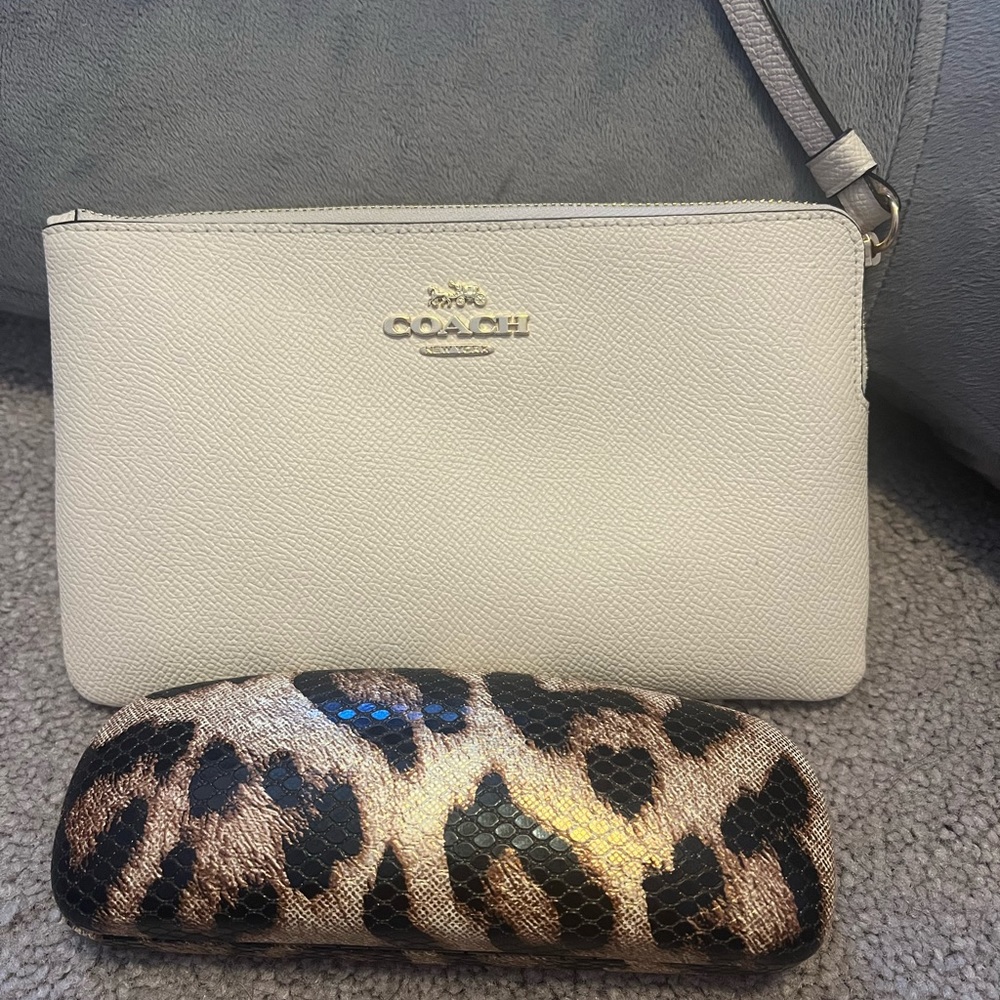 Off white Coach wristlet.